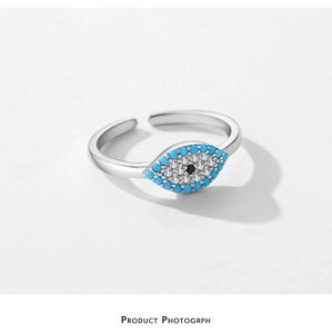 Detailed view of s925 silver adjustable ring featuring turquoise evil eye gemstone inlay