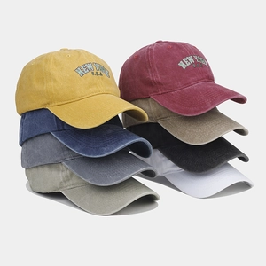 Multiple colors of vintage washed cotton baseball caps with New York USA embroidery