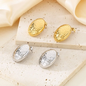 Minimalist irregular hammered oval stainless steel stud earrings in gold and silver