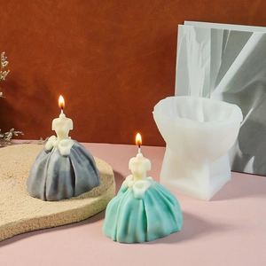 Detail of DIY wedding dress silicone candle mold with finished handmade candles