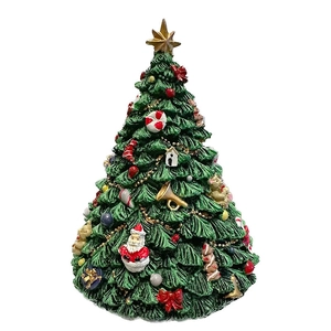 Rotating Christmas tree music box with festive decorations and a star topper
