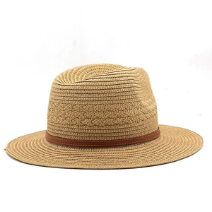Detail of woven Panama hat featuring a slim dark brown leather band with stitch work