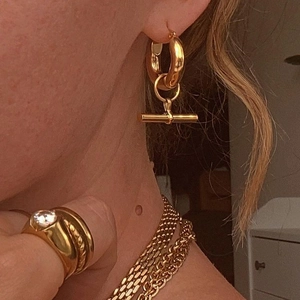 Golden geometry T-bar pendant hoop earrings with matching ring and layered necklaces