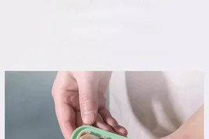 Detail of a four-cavity green silicone mold creating 3D bear-shaped ice cubes for drinks
