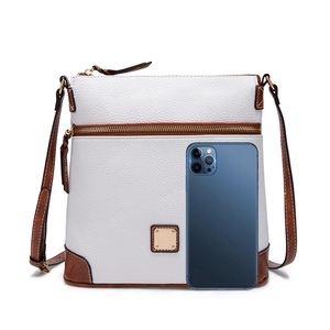 Detail of lychee textured leather crossbody bag in white and caramel with phone scale