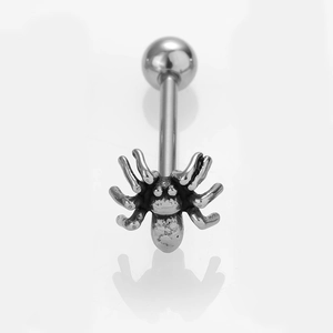 Macro view of a silver spider-shaped stainless steel belly button ring with detailed engraving