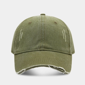 Close-up of olive green baseball cap showing vintage washed fabric and distressed brim detail
