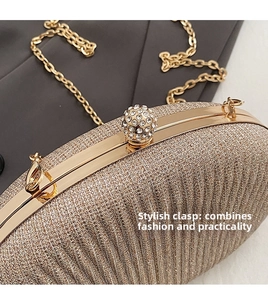 Detail of champagne gold evening clutch with sequin texture and sparkling diamond ball clasp