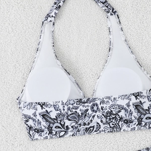 Detail of paisley print bikini top with white mesh lining and removable soft pads