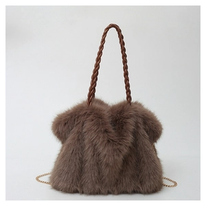 Detailed view of plush brown faux fur tote with woven handle and gold chain accents
