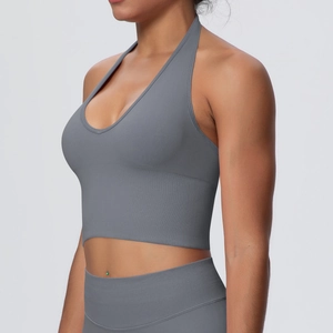 Detail of dark grey seamless ribbed yoga set showing halter neck bra and high waist leggings