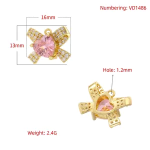 Bowknot pendant with pink heart cubic zirconia and white pavé crystals in 18K gold plating