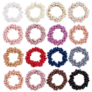 Set of 16 colorful pearl elastic hair ties in a grid layout for ponytail styling