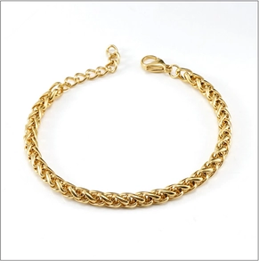 Macro detail of 18K gold plated stainless steel wheat chain bracelet with lobster clasp