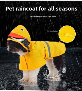 Detail of yellow duck dog raincoat with waterproof fabric and safety reflective strip
