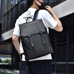 Black leather minimalist laptop backpack with dual buckle straps for travel and school