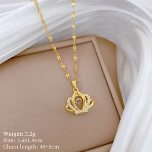Detailed specs of titanium crown necklace pendant on elegant silk display box
