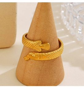 Detail of 18K gold-plated koi fish open ring with fine scale texture on wood stand