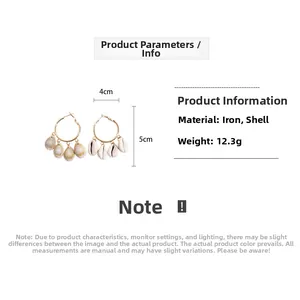 Detail view of round hoop earrings with shell tassels and precise size measurements