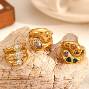 Gold plated stainless steel rings set with pear, round, and multicolor heart stones