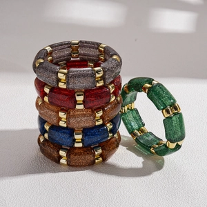 Ethnic acrylic geometric round beaded stretch bracelet with glitter finish and gold accents