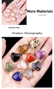 Macro detail of heart-shaped synthetic opal connector with metal edges for DIY jewelry