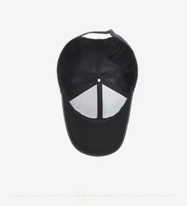 Detail view of the black baseball cap interior with breathable mesh and adjustable metal buckle