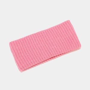 Close-up of pink ribbed knit texture on athletic headband showing material detail
