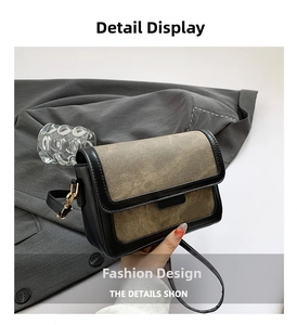 Detail of vintage patchwork shoulder bag featuring khaki suede and black leather accents