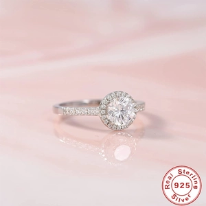 Macro shot of 925 sterling silver ring with halo setting and engraved silver hallmark