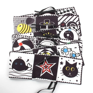 Black and white high contrast baby cloth book with whale and animal patterns for sensory play