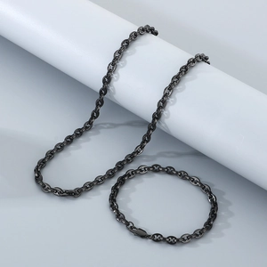 Detail view of black stainless steel H-link chain necklace and matching bracelet set