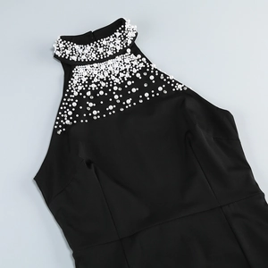 Detail of elegant black halter dress with luxury pearl and rhinestone neckline embroidery