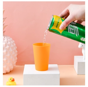 Detail of a bright orange stacking cup for toddler early education training