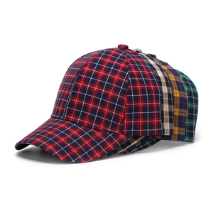 Detail showing various plaid baseball caps in red, yellow, green, and beige patterns