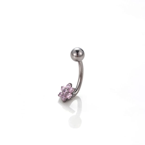 Macro detail of G23 titanium belly ring featuring a pink zircon flower and curved barbell