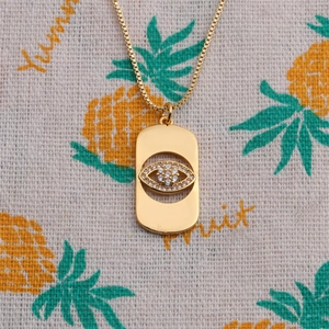 Gold-plated evil eye pendant necklace with cubic zirconia on a classic box chain
