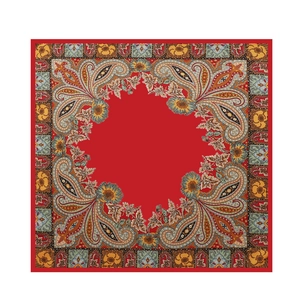 Macro detail of red paisley pattern silk scarf with intricate floral satin print square