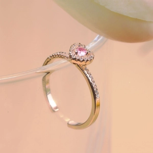 Detail of rose gold adjustable heart ring with pink zircon and micro-pave setting