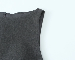 Close-up of sleeveless dress neck with invisible zipper and fine fabric texture