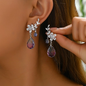 Floral silver earrings with zircon inlay and purple gradient teardrop pendant on model