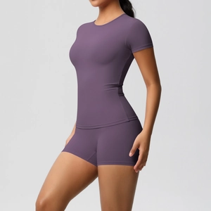 Detail of purple high-elastic yoga set showing slim fit and brushed fabric texture