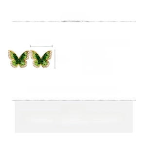 Detail showing 18k gold plated butterfly earrings with green crystals and measurements