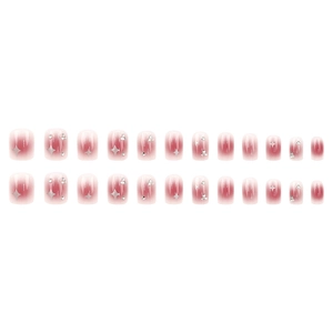 Sparkling pink gradient press-on nails with silver star patterns and rhinestone accents