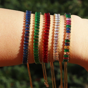 Close-up of colorful square-cut zircon tennis bracelets with adjustable gold chain