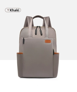 Front view of khaki nylon laptop backpack featuring orange-brown leather patch detail