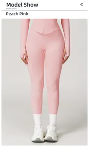 Detail of peach pink ribbed knit yoga set featuring thumbhole sleeves and high waist texture