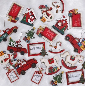 Flat lay of colorful wooden Christmas ornaments on white faux fur background with holiday text
