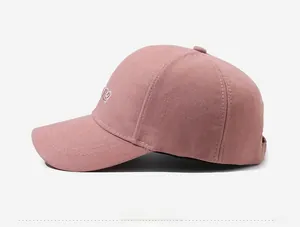 Detailed side view of dusty rose baseball cap featuring white embroidered PE letters