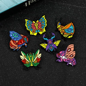 Set of six colorful insect enamel pins featuring butterfly, moth, beetle, and bee designs